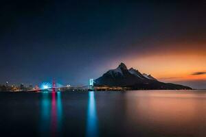 the city lights up at night in front of a mountain. AI-Generated photo