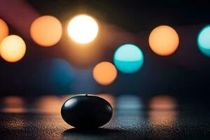 a black ball sits on a table in front of a bright light. AI-Generated photo