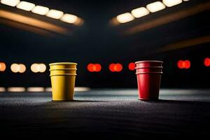 two red and yellow cups on a dark floor. AI-Generated photo