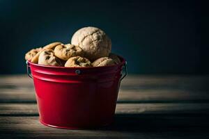 un rojo Cubeta lleno con galletas y nueces. generado por ai foto