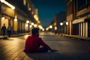 un hombre sentado en el suelo en el medio de un ciudad calle a noche. generado por ai foto