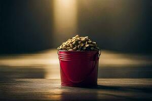 un rojo Cubeta lleno con nueces en un de madera mesa. generado por ai foto