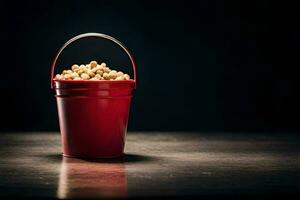 un rojo Cubeta lleno con palomitas de maiz en un oscuro mesa. generado por ai foto