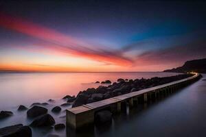 un largo exposición fotografía de un muelle a puesta de sol. generado por ai foto