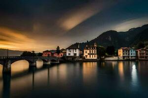 a bridge over a lake at sunset with houses and mountains in the background. AI-Generated photo