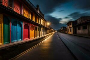 a street lined with colorful buildings at night. AI-Generated photo