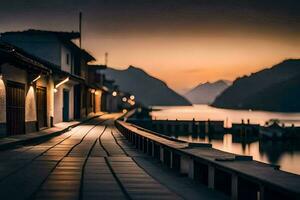 a long walkway along the water with houses and mountains in the background. AI-Generated photo