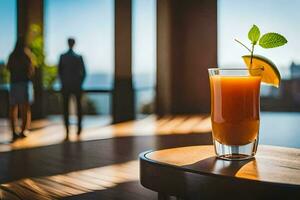 un vaso de naranja jugo sentado en un mesa en frente de un hombre. generado por ai foto