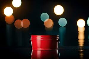 a red bucket sitting on a table with lights in the background. AI-Generated photo