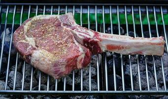 Tomahawk steak with herbs and spices photo