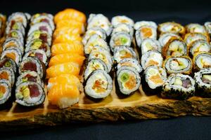 different Kinds of asia seafood sushi on a slate photo