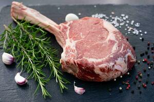 Tomahawk steak with herbs and spices photo