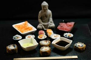 different Kinds of asia seafood sushi on a slate photo