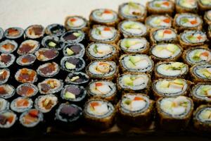 different Kinds of asia seafood sushi on a slate photo