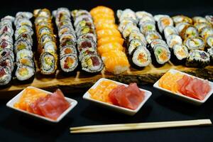 different Kinds of asia seafood sushi on a slate photo