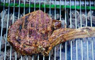 Tomahawk steak with herbs and spices photo