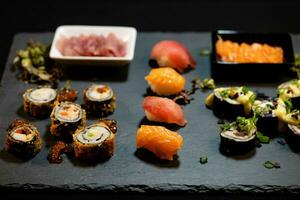 different Kinds of asia seafood sushi on a slate photo