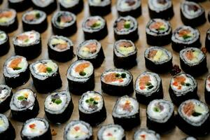 different Kinds of asia seafood sushi on a slate photo