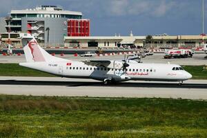 Tunisair passenger plane at airport. Schedule flight travel. Aviation and aircraft. Air transport. Global international transportation. Fly and flying. photo