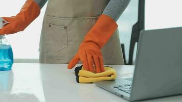 Housewife using vacuum cleaner on the floor. Wearing an apron to clean the living room at house. Young woman is happy to clean home. Maid cleaning service. video