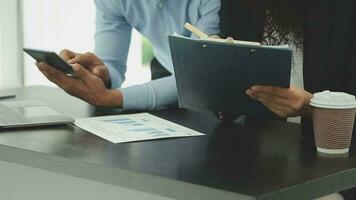 Business team collaboration discussing working analyzing with financial data and marketing growth report graph in team, presentation and brainstorming to strategy planning making profit of company. video