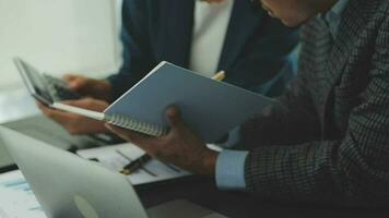 Business team collaboration discussing working analyzing with financial data and marketing growth report graph in team, presentation and brainstorming to strategy planning making profit of company. video