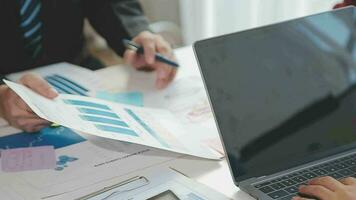 Business team collaboration discussing working analyzing with financial data and marketing growth report graph in team, presentation and brainstorming to strategy planning making profit of company. video