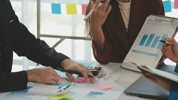 Business team collaboration discussing working analyzing with financial data and marketing growth report graph in team, presentation and brainstorming to strategy planning making profit of company. video