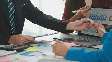 Business team collaboration discussing working analyzing with financial data and marketing growth report graph in team, presentation and brainstorming to strategy planning making profit of company. video