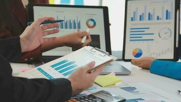 Business team collaboration discussing working analyzing with financial data and marketing growth report graph in team, presentation and brainstorming to strategy planning making profit of company. video