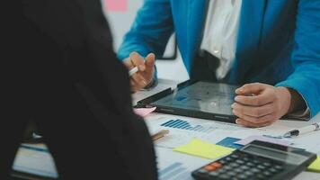 Business team collaboration discussing working analyzing with financial data and marketing growth report graph in team, presentation and brainstorming to strategy planning making profit of company. video