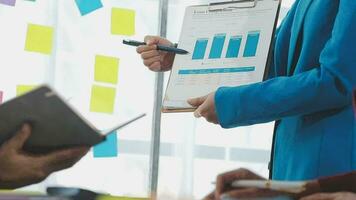 Business team collaboration discussing working analyzing with financial data and marketing growth report graph in team, presentation and brainstorming to strategy planning making profit of company. video