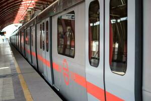 Delhi, India-July 16 2023-Delhi Metro train arriving at Jhandewalan metro station in New Delhi, India, Asia, Public Metro departing from Jhandewalan station in which more than 20 lakhs passengers photo