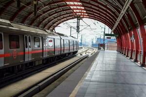 New Delhi India - August 10 2023 - Delhi Metro train arriving at Jhandewalan metro station in New Delhi, India, Asia, Public Metro departing from Jhandewalan station photo