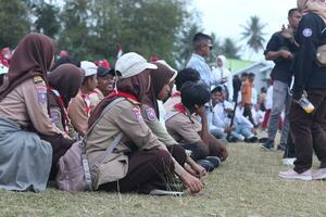 Gorontalo, Indonesia - August 17, 2023 - Scout members assisted in the organization of the flag lowering ceremony during the 78th Independence Day of Indonesia. Anggota pramuka photo