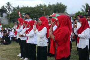 Gorontalo, Indonesia - August 17, 2023 - A group of hearing-impaired individuals becomes a choir guide group during the commemoration of Indonesia's 78th Independence Day photo