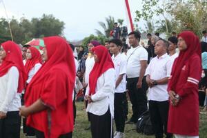 Gorontalo, Indonesia - August 17, 2023 - A group of hearing-impaired individuals becomes a choir guide group during the commemoration of Indonesia's 78th Independence Day photo