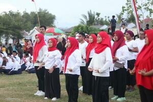 Gorontalo, Indonesia - August 17, 2023 - A group of hearing-impaired individuals becomes a choir guide group during the commemoration of Indonesia's 78th Independence Day photo