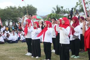 Gorontalo, Indonesia - August 17, 2023 - A group of hearing-impaired individuals becomes a choir guide group during the commemoration of Indonesia's 78th Independence Day photo