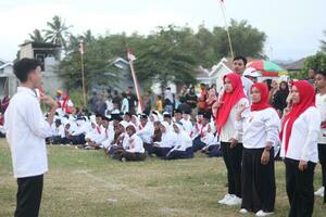 Gorontalo, Indonesia - August 17, 2023 - A group of hearing-impaired individuals becomes a choir guide group during the commemoration of Indonesia's 78th Independence Day photo