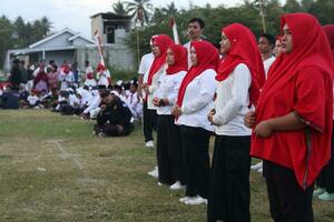 Gorontalo, Indonesia - August 17, 2023 - A group of hearing-impaired individuals becomes a choir guide group during the commemoration of Indonesia's 78th Independence Day photo