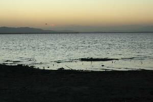 Beautiful golden sunset on the lake photo