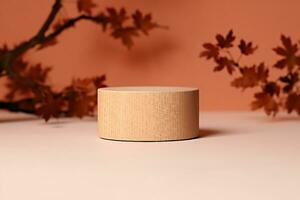 brown box made of precious wood, block, cylindrical podium, branch with maple leaves on a peach-colored background. conceptual autumn scene, stage showcase, product, promotion. generative ai. photo