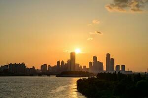 The night view of the city of Yeouido, a high-rise building, shot at Dongjak Bridge in Seoul at sunset photo