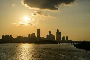 The night view of the city of Yeouido, a high-rise building, shot at Dongjak Bridge in Seoul at sunset photo