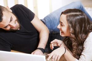 young couple plans to the computer new home photo