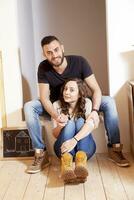 young couple moves into new home photo