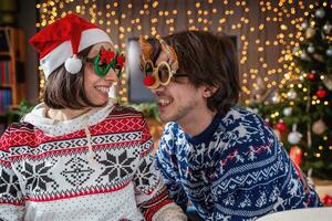 young couple of lovers celebrating having fun on christmas holy night photo