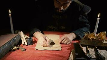 Medieval man writing letters. Historical video. video