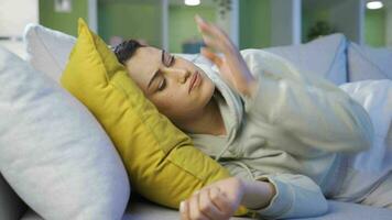 Young woman sleeping on sofa. video